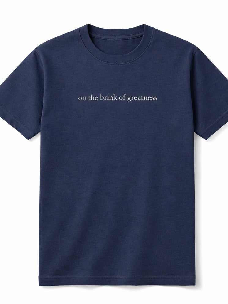 Navy t-shirt design with 'on the brink of greatness' text, digital download