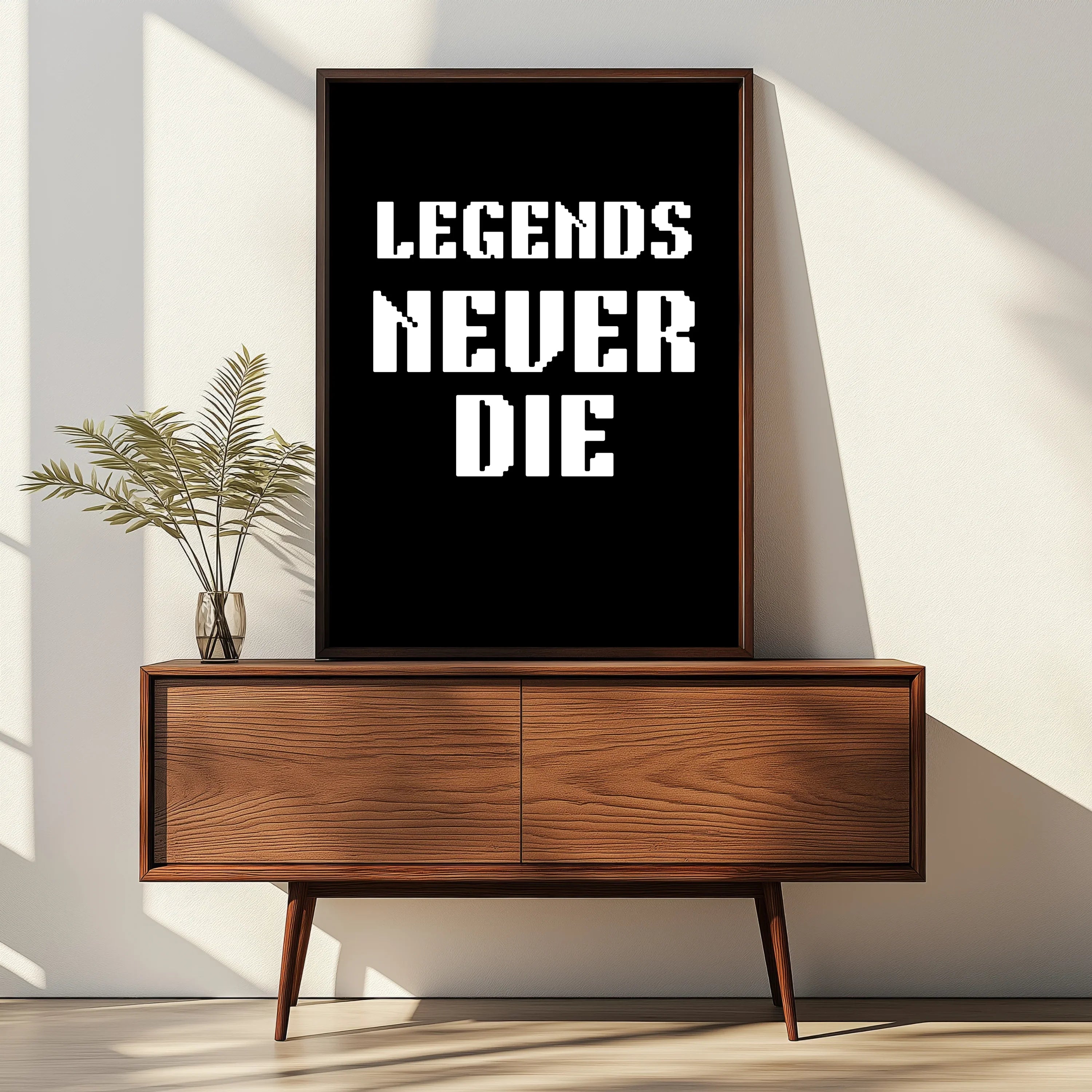 Legends Never Die motivational digital download poster in black and white, framed on wooden console A1 Business-Hub